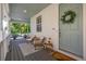 Charming front porch features seating and stylish decor at 3433 N Wabash St, Denver, CO 80238