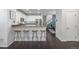Open kitchen features a breakfast bar, granite countertops, and stainless appliances at 3433 N Wabash St, Denver, CO 80238