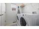 Functional laundry room includes a washer and dryer plus shelf storage at 3433 N Wabash St, Denver, CO 80238