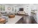 Bright living room features modern decor, dark wood floors, and an open layout at 3433 N Wabash St, Denver, CO 80238