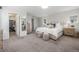 Spacious bedroom features carpeted floors, neutral decor, and ample closet space at 3433 N Wabash St, Denver, CO 80238