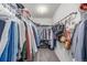 Organized walk-in closet with ample hanging space and shelving for storage at 3433 N Wabash St, Denver, CO 80238