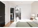 Bedroom with a view into the bathroom and hallway at 1836 Grove St # 107, Denver, CO 80204