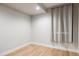 Small bedroom with light hardwood floors and window coverings at 1836 Grove St # 107, Denver, CO 80204