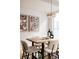 Elegant dining area with a live-edge table and modern chairs at 1836 Grove St # 107, Denver, CO 80204
