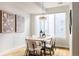 Bright dining room featuring a large table and plenty of natural light at 1836 Grove St # 107, Denver, CO 80204