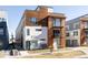 Modern three-story building with wood and metal siding at 1836 Grove St # 107, Denver, CO 80204