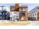 Modern three-story building with wood and metal siding at 1836 Grove St # 107, Denver, CO 80204
