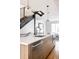 Modern kitchen island with sleek countertops and stainless steel dishwasher at 1836 Grove St # 107, Denver, CO 80204