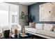 Spacious living area with large windows and modern furniture at 1836 Grove St # 107, Denver, CO 80204