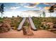 Playground with slides and rock formations, set in a natural landscape, perfect for outdoor play and exploration at 6322 N Malaya St, Aurora, CO 80019