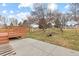 Large backyard featuring a wooden deck and patio area, perfect for outdoor entertaining and relaxation at 1189 Fall River Cir, Longmont, CO 80504