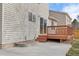 An outdoor patio and deck create great backyard retreat space, as well as the light siding of the home at 1189 Fall River Cir, Longmont, CO 80504