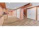 Finished basement with wood flooring, modern lighting, cabinets, and convenient storage spaces at 1189 Fall River Cir, Longmont, CO 80504