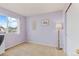 Cozy bedroom with soft purple walls, a bright window, and neutral carpeting at 1189 Fall River Cir, Longmont, CO 80504