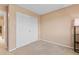 Bedroom with neutral walls and carpet, featuring a large closet with white doors at 1189 Fall River Cir, Longmont, CO 80504