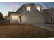 Charming two-story home with a welcoming front porch and well-maintained lawn at 1189 Fall River Cir, Longmont, CO 80504