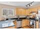 Lovely kitchen featuring granite countertops, stainless steel appliances, and tile backsplash at 1189 Fall River Cir, Longmont, CO 80504