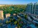 Scenic aerial view of apartment buildings overlooking a sprawling golf course and tree-lined neighborhood at 45 N Ogden St # 309, Denver, CO 80218