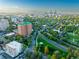 Breathtaking aerial shot of downtown skyline surrounded by lush greenery in a vibrant urban landscape at 45 N Ogden St # 309, Denver, CO 80218