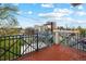 Balcony with wrought iron railing and views of the surrounding neighborhood at 45 N Ogden St # 309, Denver, CO 80218