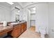 Bathroom featuring a double sink vanity with a view of the walk in closet at 45 N Ogden St # 309, Denver, CO 80218