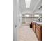 Bathroom featuring a soaking tub with shower and a double sink vanity at 45 N Ogden St # 309, Denver, CO 80218