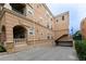 An apartment building featuring stucco walls and a covered parking garage with easy access for residents at 45 N Ogden St # 309, Denver, CO 80218