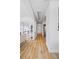 Spacious hallway features hardwood floors, skylights, and arched entryways to other rooms at 45 N Ogden St # 309, Denver, CO 80218