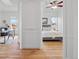 View from a doorway of a bedroom with a ceiling fan and wood floors at 45 N Ogden St # 309, Denver, CO 80218