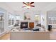 Inviting living room featuring a fireplace, hardwood floors, and bright windows at 45 N Ogden St # 309, Denver, CO 80218