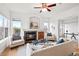 Living room with fireplace, hardwood floors, and a view of the office through an open doorway at 45 N Ogden St # 309, Denver, CO 80218