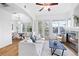 Bright living room with fireplace, hardwood floors, large windows, and adjacent dining area at 45 N Ogden St # 309, Denver, CO 80218
