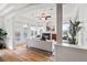 Open-concept living room with hardwood floors, fireplace, balcony access, and natural light at 45 N Ogden St # 309, Denver, CO 80218