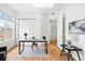Bright home office features a skylight, hardwood floors, and ample storage with a minimalist desk and chair at 45 N Ogden St # 309, Denver, CO 80218