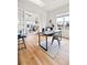 Open-concept office area featuring natural light, hardwood floors, and a view of the living room at 45 N Ogden St # 309, Denver, CO 80218
