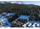 Foundation under construction from above, snow-capped mountains and dense forest providing a scenic backdrop at 528 N Fuller Placer, Breckenridge, CO 80424