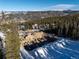 Aerial shot of foundation construction with views of snow-capped mountains and trees in a neighborhood at 528 N Fuller Placer, Breckenridge, CO 80424