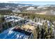 Aerial shot of the construction site with mountain views, surrounding trees, and foundation work in progress at 528 N Fuller Placer, Breckenridge, CO 80424