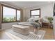 Sun-filled bedroom with large windows and a cozy sitting area with scenic outdoor views at 528 N Fuller Placer, Breckenridge, CO 80424