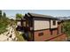 Three story home showcasing wood and stone exterior with multiple levels and balconies at 528 N Fuller Placer, Breckenridge, CO 80424