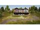 View of the exterior, showcasing the home's setting, landscaping, front entry and architecture at 528 N Fuller Placer, Breckenridge, CO 80424