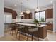Modern kitchen with wooden cabinets, stainless steel appliances, a marble counter, and island seating at 528 N Fuller Placer, Breckenridge, CO 80424