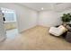 Open basement space with carpet, ideal for recreation or storage, featuring a nearby bathroom at 7722 E 6Th Pl, Denver, CO 80230