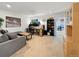 Spacious finished basement with a work station, couch, and storage, perfect for relaxing or hobbies at 7722 E 6Th Pl, Denver, CO 80230