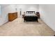 Basement bedroom featuring carpet, natural light and furnishings for comfortable living at 7722 E 6Th Pl, Denver, CO 80230
