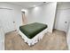 Empty basement bedroom with carpet flooring, white walls and trim, and two doors at 7722 E 6Th Pl, Denver, CO 80230