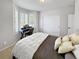 Comfortable bedroom with a writing desk, closet, and shuttered window at 7722 E 6Th Pl, Denver, CO 80230