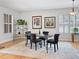 Elegant dining room with modern decor, bright windows, and neutral colors at 7722 E 6Th Pl, Denver, CO 80230