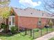 Charming brick home featuring a well-maintained yard and classic architectural details at 7722 E 6Th Pl, Denver, CO 80230